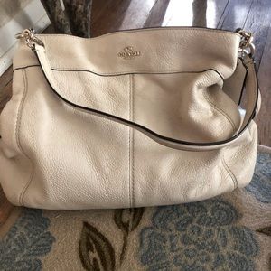 Cream colored coach purse. In great shape